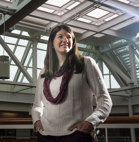 Corrie Smeaton standing in the laboratory's atrium.  