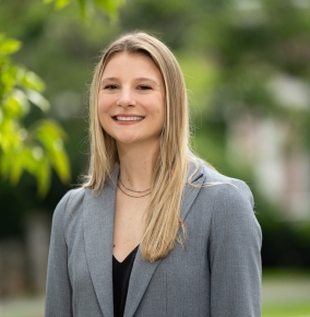 An outdoor portrait photograph of Rebecca Laher.