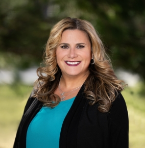 An outdoor portrait photograph of Michele Gruber.