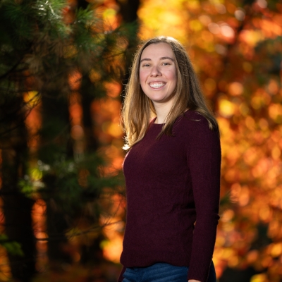 Photo of Isabel Smokelin outside near trees in autumn