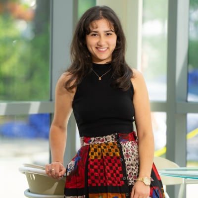 A portrait photograph of Ashley Kamal. 