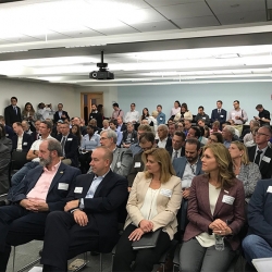 Attendees, hailing from startups, venture capital companies, DoD organizations, and non-profits, packed the room to hear two panel discussions before breakout sessions in the Venture Café.