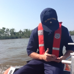 A U.S. Coast Guard responder offshore is able to access real-time information from NICS' onshore computers on a mobile device. Photo: Amna Greaves