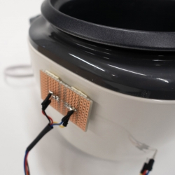 Rice cooker with attached infrared sensor.