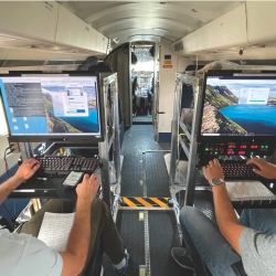 A photo of two operators on an aircraft using the Laboratory's Airborne Radar Testbed to command a radar to test and demonstrate intelligence, surveillance, and reconnaissance radar concepts.