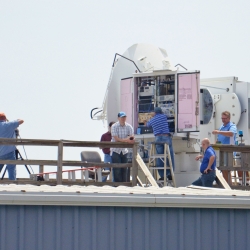 Six people work on radars at a naval air station. 