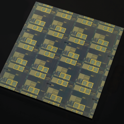 This optical image shows a large-area AI-optimized fabric with 16 reticles (i.e., lithographic guides for patterning integrated circuits on the material).  