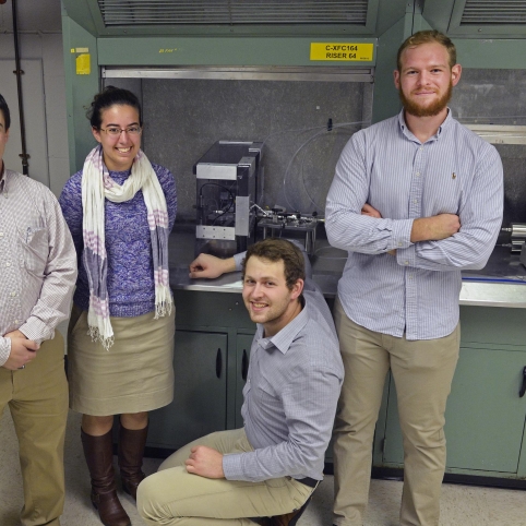 WPI students, with the guidance of their Lincoln Laboratory mentor (left) developed a liquid-propellant propulsion system for picosatellites for their Major Qualifying Project.  