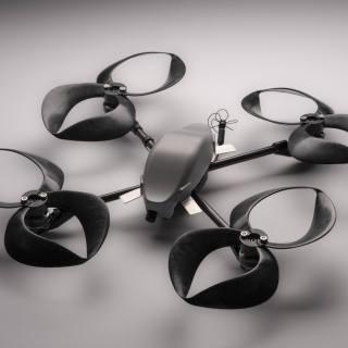 A small commercial drone outfitted with four toroidal propellers (each propeller looks like two loops, made of plastic).