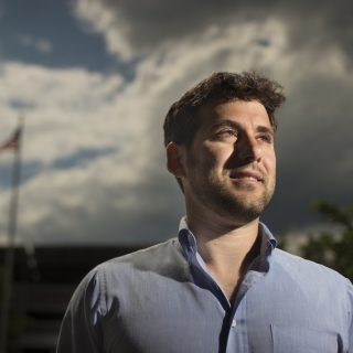 A portrait photograph of Andrew Mack.