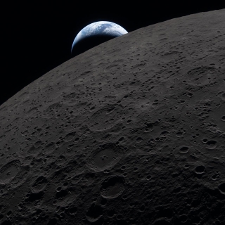Earth sets behind the Moon on April 6, 2026, as captured from the Artemis II Orion spacecraft.