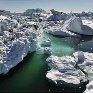 Chunks of fractured sea ice create passageways through the water.