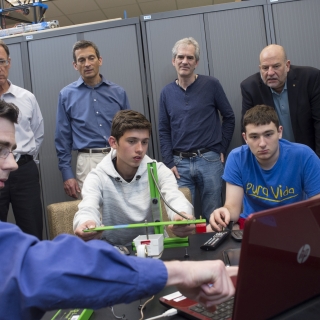 Laboratory staff help students in Explorer Post understand the functionality of seismic monitoring instrumentation.