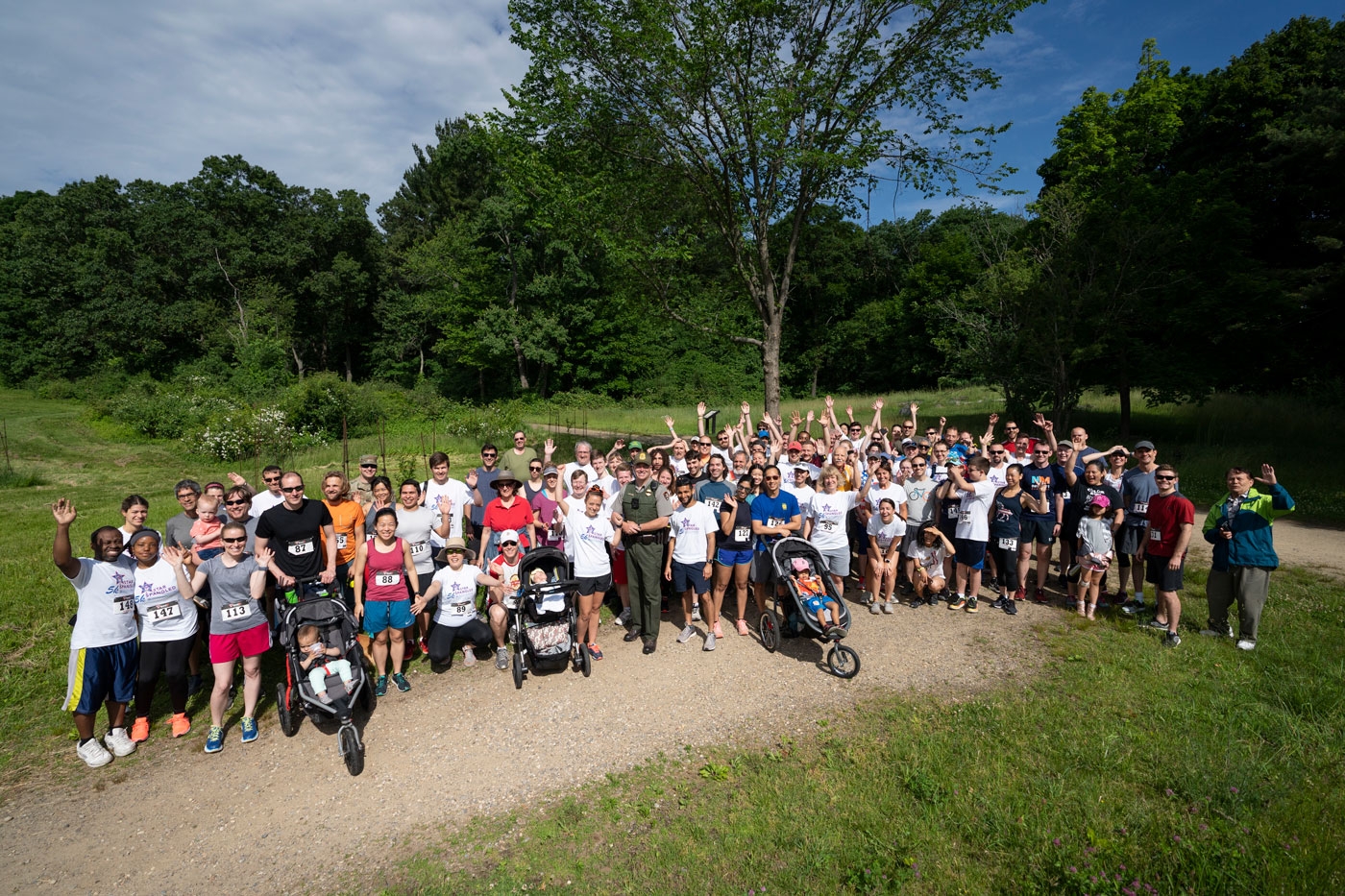 More than 100 Laboratory employees and their friends and families pose at the annual Star Spangled 5K Fun Run