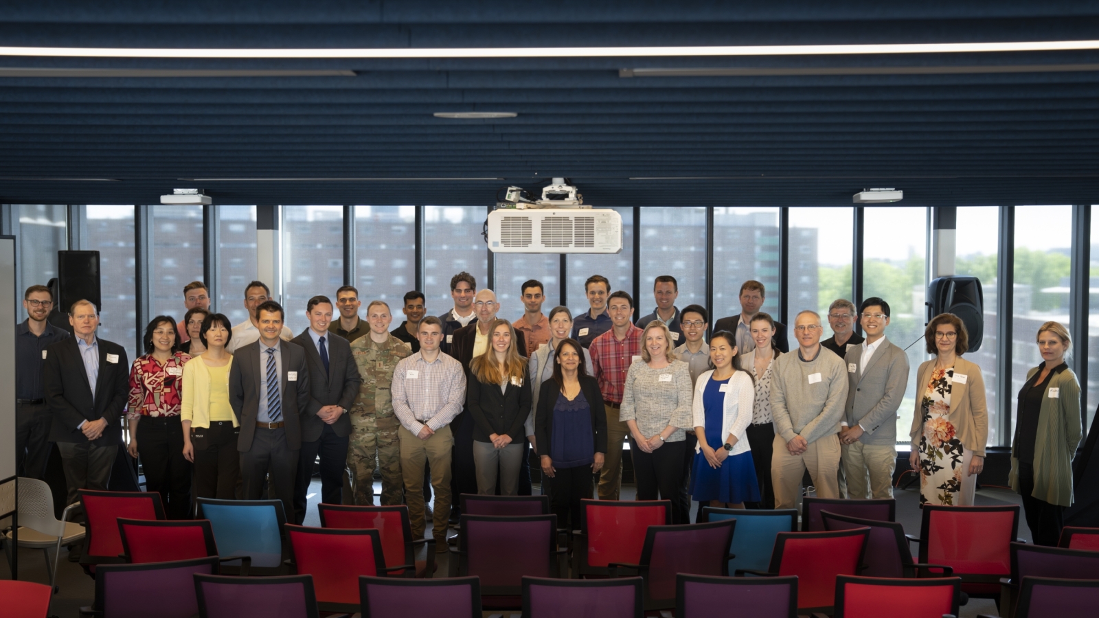 Lincoln Scholars, Military Fellows, and their mentors gather for a photo at a luncheon hosted by the Lincoln Laboratory – MIT Campus Interaction Committee to highlight collaborative research.