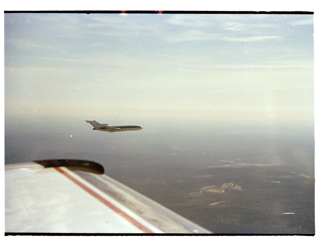 Two aircraft fly in proximity.