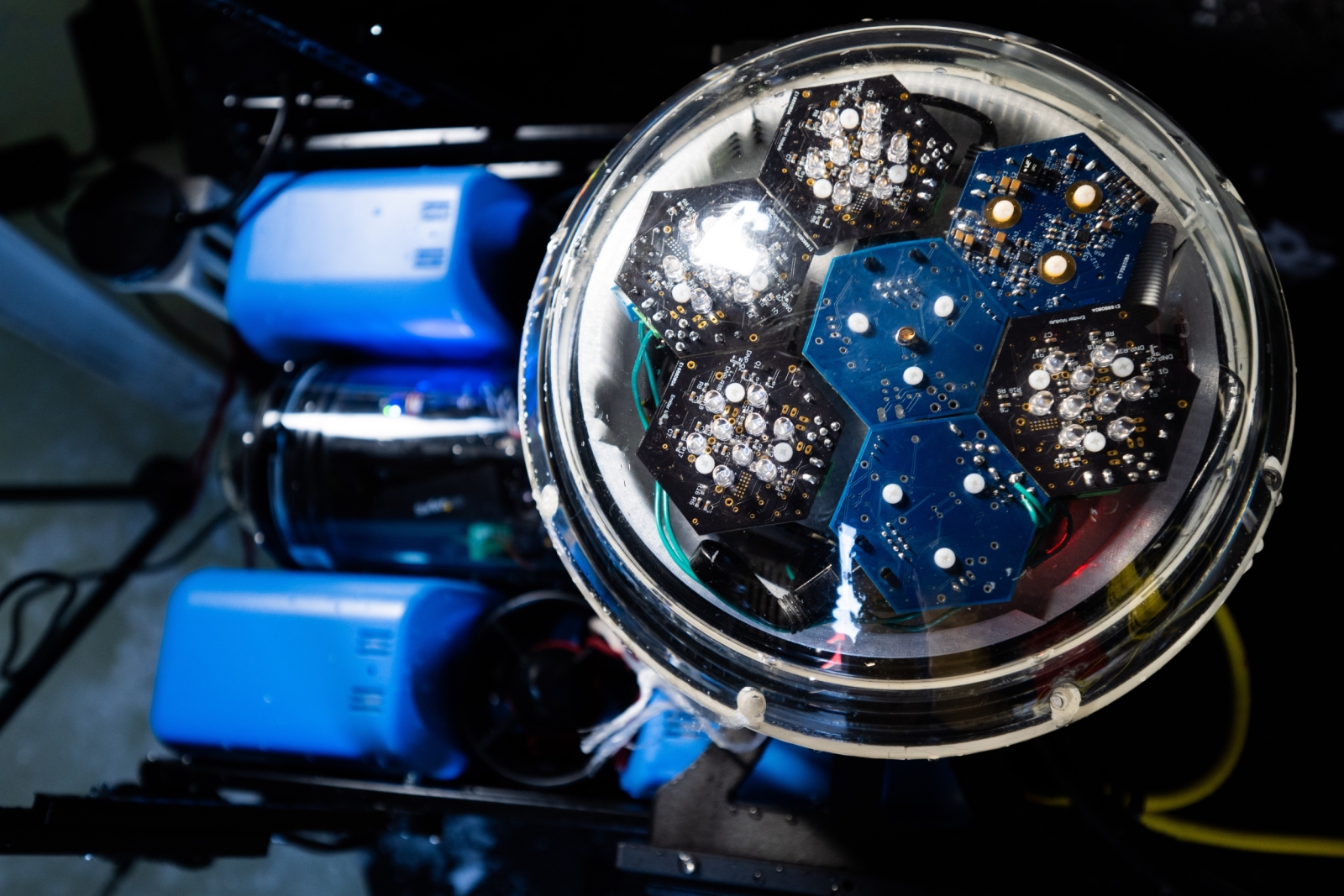 A communications device enclosed in a vessel has hexagon-structures containing sensors.
