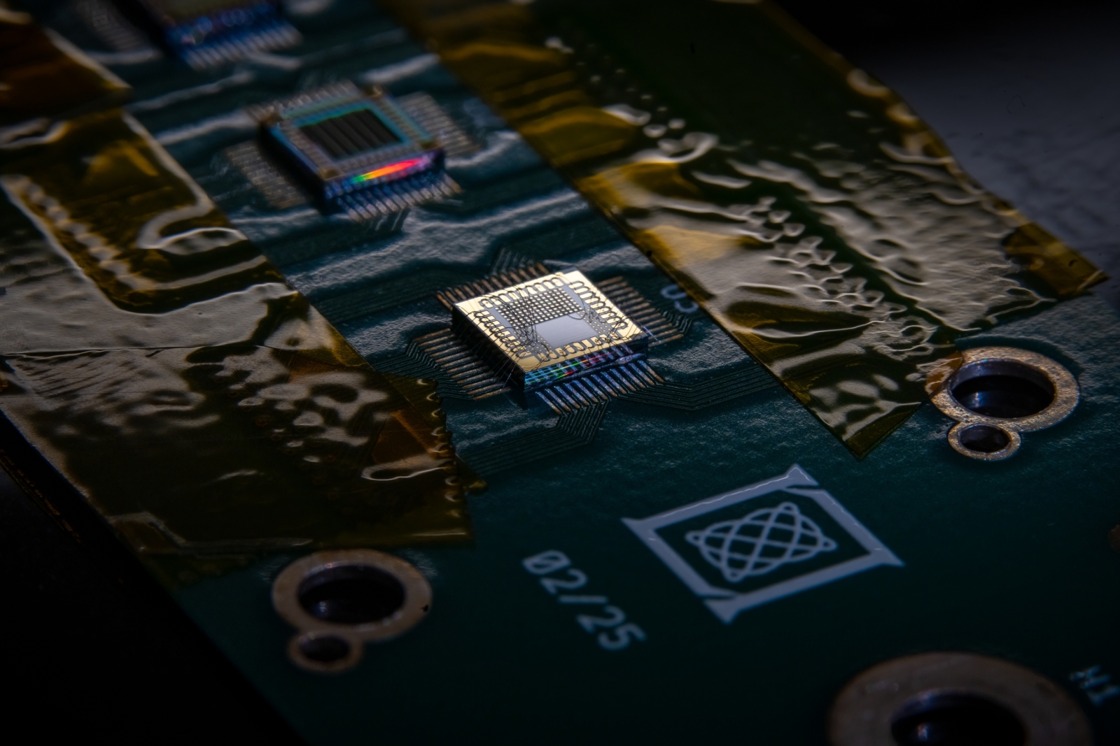 An integrated circuit is shown bonded to a printed circuit board. 
