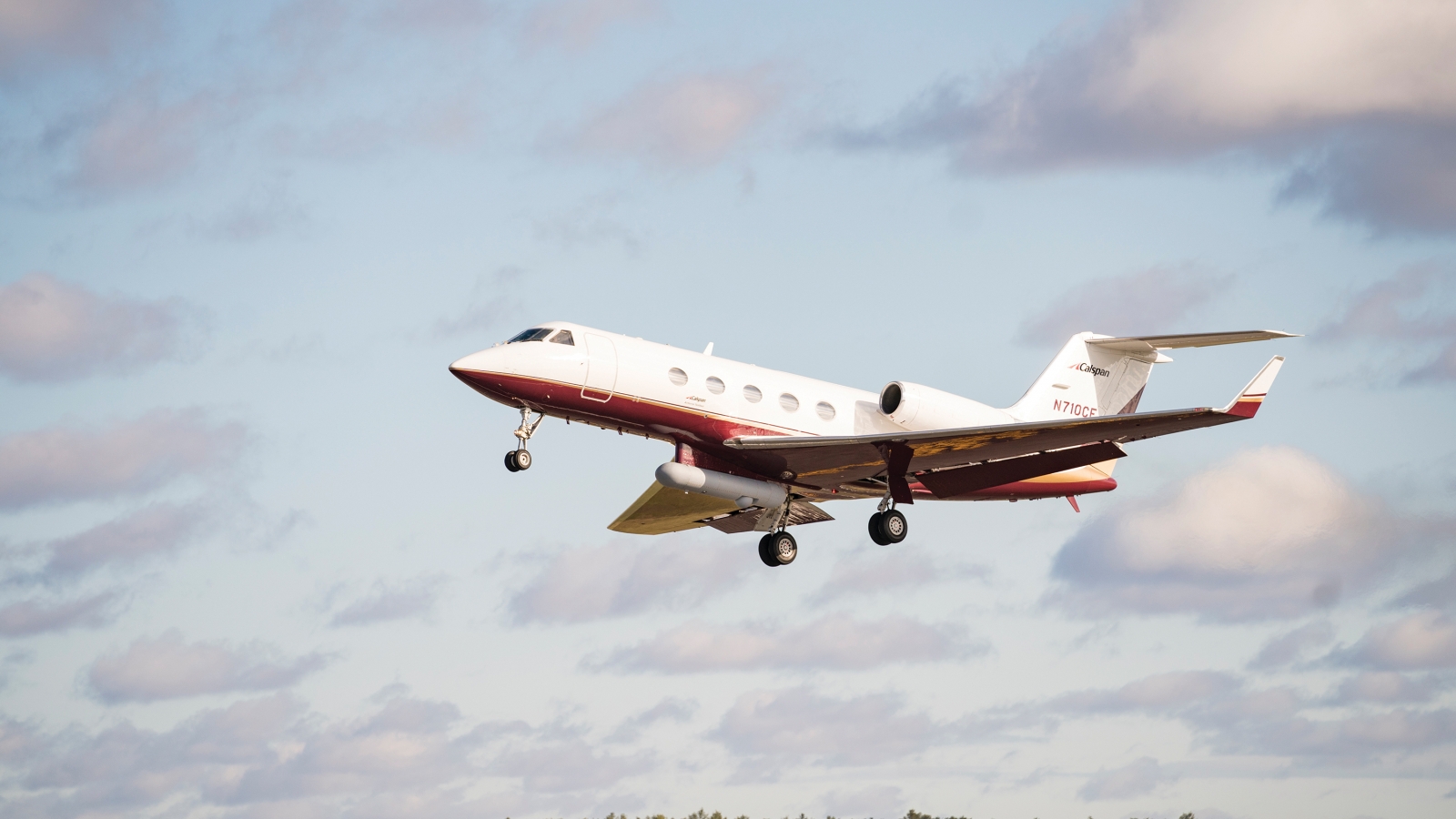A Gulfstream III aircraft is shown with a PACECR communications pod attached.