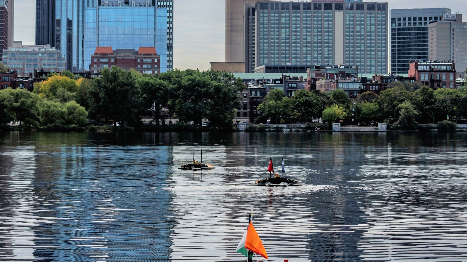 A photo of unmanned surface vehicles on the Charles River.