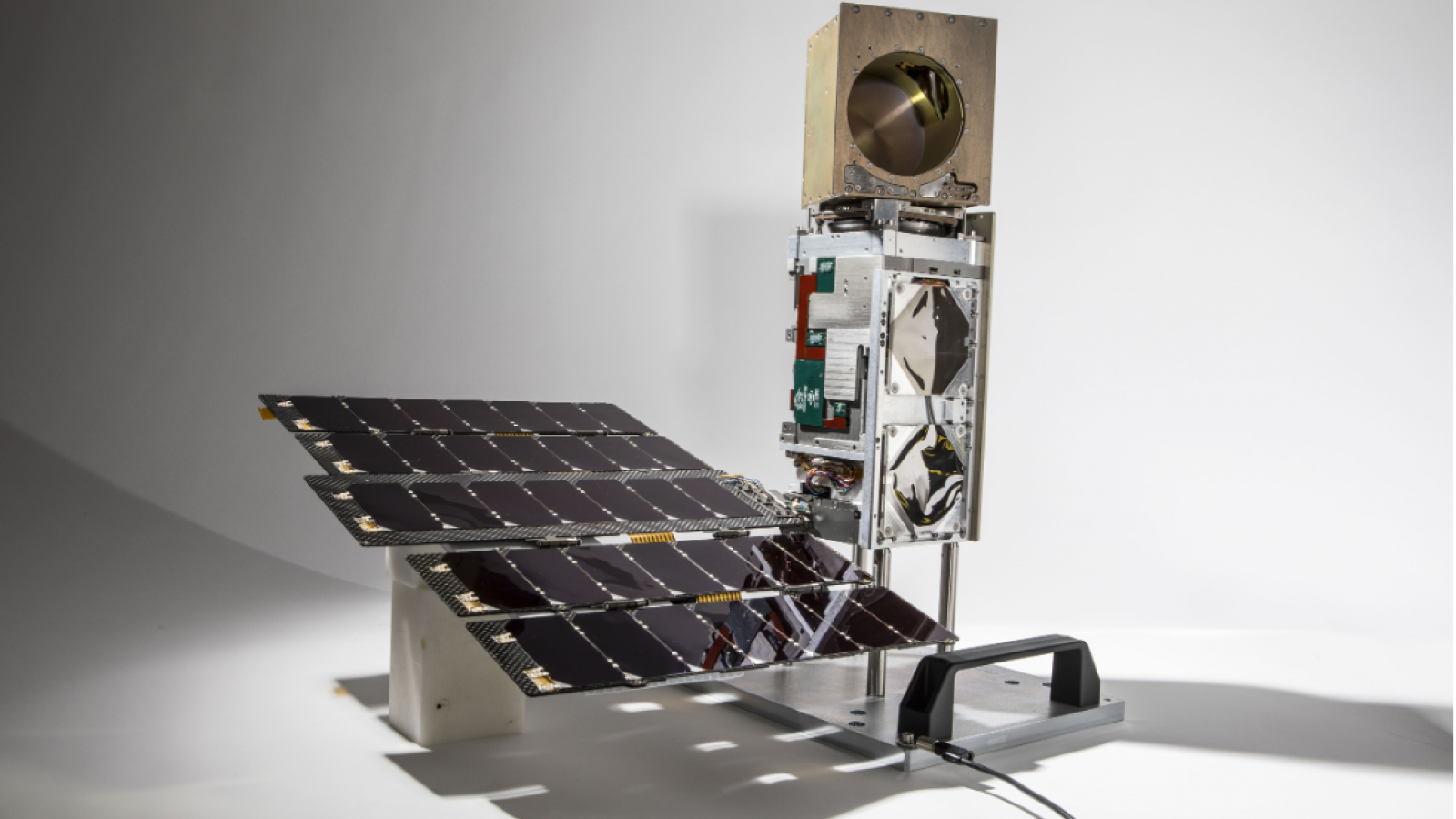 a photo of a small satellite in a studio