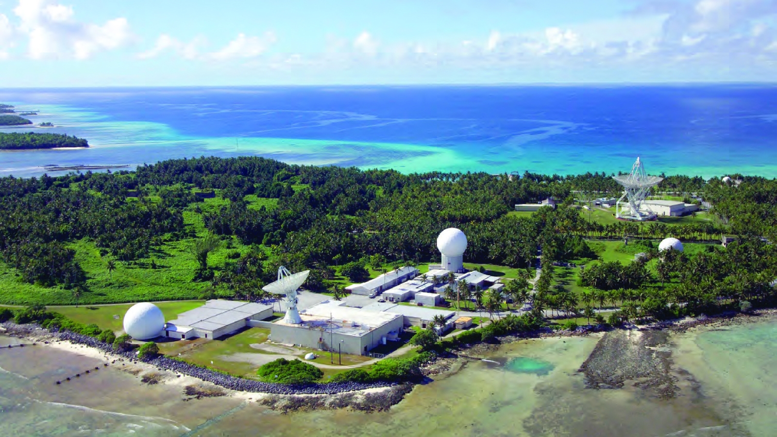 A photograph of a suite of radars on an island. 