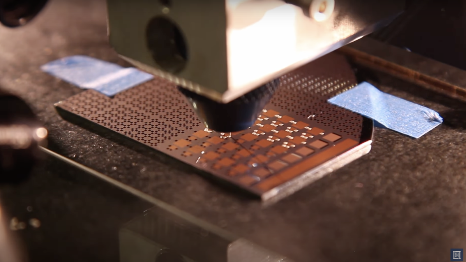 a close-up view of a 3D printer head depositing material. 