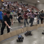 Students in the Beaver Works Summer Institute’s Autonomous RACECAR course follow their cars during the program’s final race. Photo: Glen Cooper