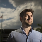 A portrait photograph of Andrew Mack. 