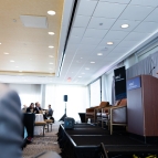 Evelyn Wang, MIT Vice President for Energy and Climate, presents from the a podium at the front of a room of attendees.