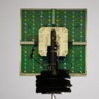 A scanning reflectarray antenna lights up with its individual reflective elements.