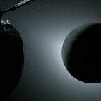 The moon is backlit by the sun during a solar eclipse.