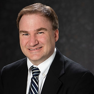 A portrait photo of Roger Dufour.