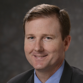 A portrait photograph of W. Mark Smith.