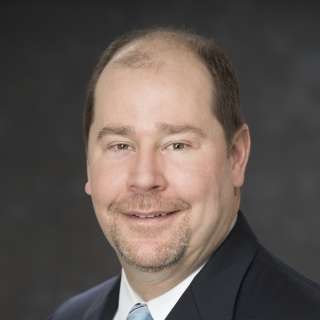 A portrait photograph of Scott Hamilton.