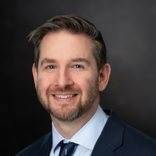 A portrait photograph of Evan Hanusa.