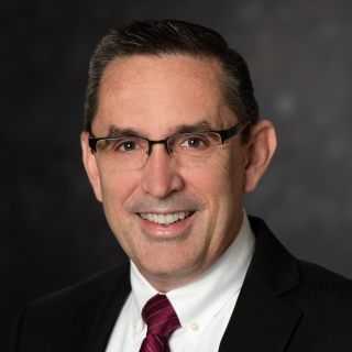 A portrait photograph of Carl E. Fossa.