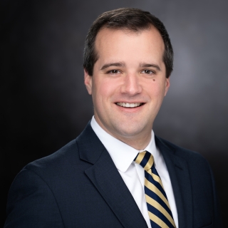 A portrait photograph of Jared Monnin.