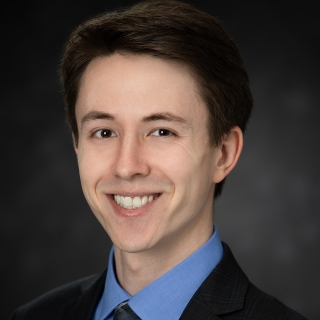formal portait of Ian McQuoid